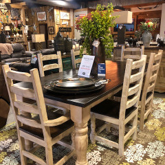 The picture does not do this table and chairs justice. It is simple but gorgeous. the table has a dark stained top and cream base. The matching ladder back chairs are comfortable and sturdy. This set comes with two arm chairs and four chairs with no arms. Come by or call for availability, price and color options.