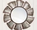 This handsome wall mirror is made of metal and the looking glass measures 16¼" in diameter.  
Overall measurement is 32¼" diameter and hangs using a keyhole hanger.