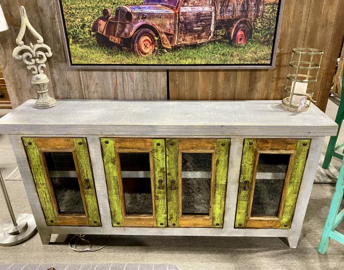 This rustic sideboard has 4 doors with old iron hardware, 4 doors with glass inserts. There is 2 shelves behind the doors to display your treasures.
Dimensions: 69"L x 15"D x 36"H
