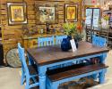 This is a 6' Santa Rita table painted and distressed in this Blue that is sure to brighten up your kitchen or dining room. You can get chairs all the way around or like shown with a bench on one side. This ever popular ensemble also comes in different colors such as white, gray and natural.