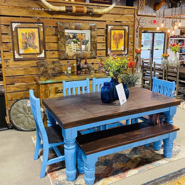 This is a 6' Santa Rita table painted and distressed in this Blue that is sure to brighten up your kitchen or dining room. You can get chairs all the way around or like shown with a bench on one side. This ever popular ensemble also comes in different colors such as white, gray and natural.