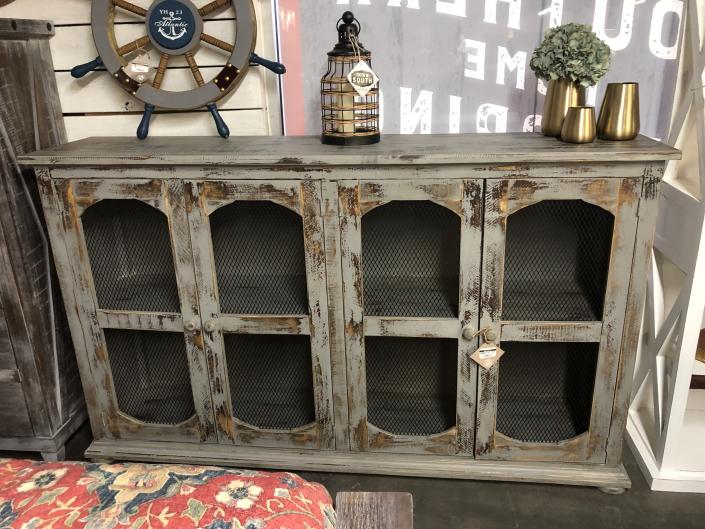 The four door wire mesh console is a perfect accent piece for your home. Made from solid wood.