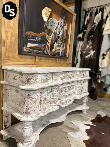 This beautiful, milk-paint distressed sideboard mixes functionality with the perfect touch of shabby chic. The Burnell Sideboard is a conversation starter AND a piece to last through the ages.