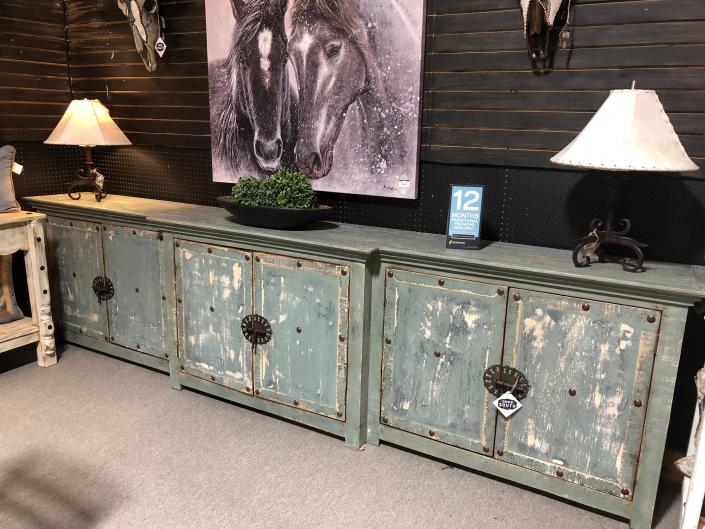 Dimensions: 138"L x 35"H x 20"W

Heavily distressed 6 door cabinet , handcrafted from solid wood and adorned with rustic iron hardware.

Behind each set of a doors is a shelf. The possibilities are endless on what you can store behind the doors.
