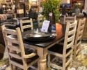 The picture does not do this table and chairs justice. It is simple but gorgeous. the table has a dark stained top and cream base. The matching ladder back chairs are comfortable and sturdy. This set comes with two arm chairs and four chairs with no arms. Come by or call for availability, price and color options.