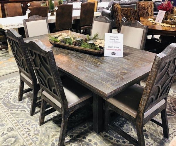 Gather for a home-cooked family meal around this beautiful wooden dining room table. With comfortable upholstered seat detailing you'll want to sit and chat around the table for hours exchanging stories. This table ties in a beautiful rustic look to your home and is the perfect centerpiece for your dining room area.  Call for availability.