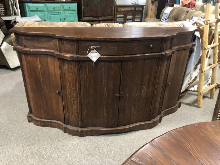 35.5"H x 19"W x 70"L

This handsome looking side board is handcrafted from solid wood. Plenty of storage underneath and a drawer for your silverware  or linen napkins.