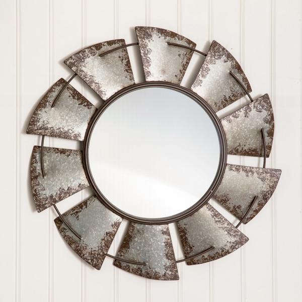 This handsome wall mirror is made of metal and the looking glass measures 16¼" in diameter.  
Overall measurement is 32¼" diameter and hangs using a keyhole hanger.