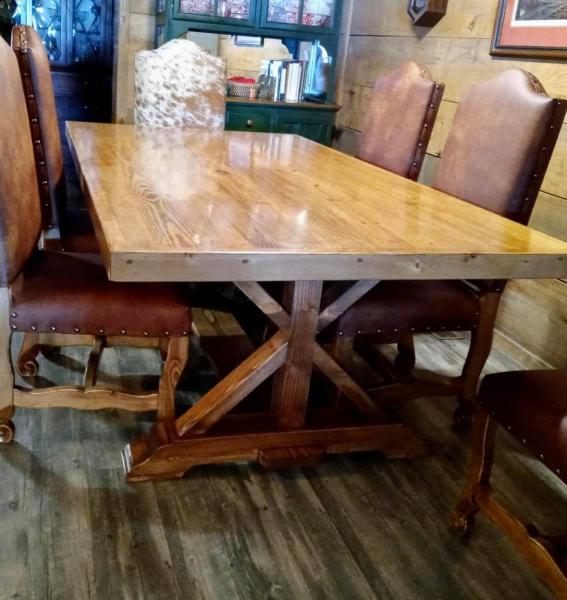 Max was able to help a customers vision of their perfect dining table and chairs come true. The table is made of solid wood and the chairs wood with premium leather and cowhide.