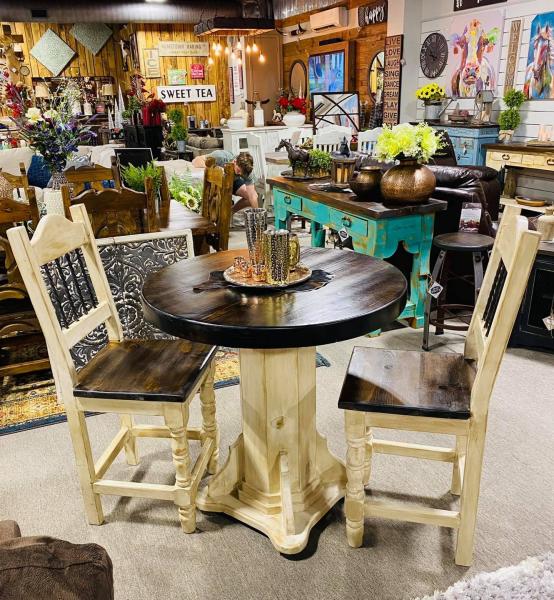 This round counter height table and chairs will make a perfect addition for a small eat in kitchen or breakfast nook, or maybe even in a game room or movie room. come on by our showroom and check this beauty out. You may call us anytime for pricing, availability and color options.