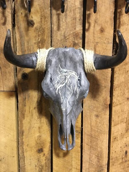 This steer skull is an original Artwork by Tanis Boatright. This steer skull has been stained to get the coloring. The horse head has been hand engraved into the skull. It comes with a Certificate of Authenticity signed by the artist.