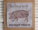 Vintage Meat Market Wall Art is printed on metal and sits on a wood frame. It hangs with two triangle ring hangers.
19¾'' sq. x ¼''D